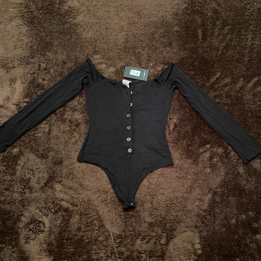 Black long sleeve button front Fashion Nova body suit. New with tags.